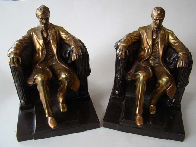 A pair of Abraham Lincoln 'sitting in the chair' bookends by the Philadelphia Manufacturing Company circa 1935